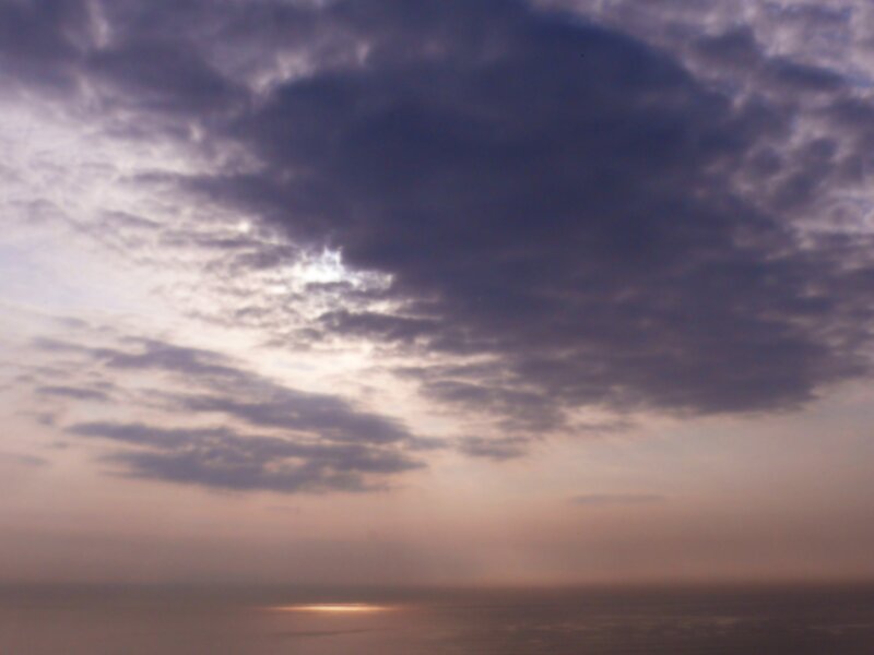 cloudy sunset over water