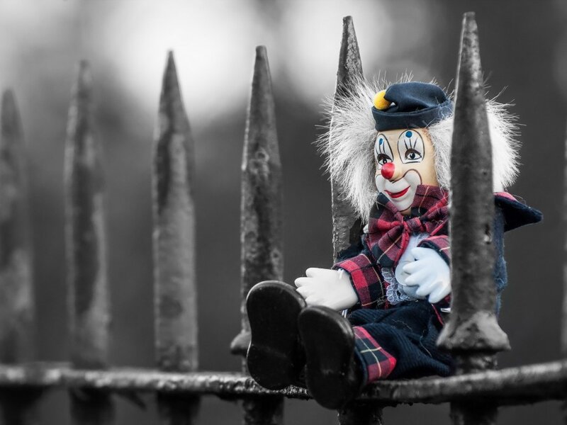 Clown Doll on Fence