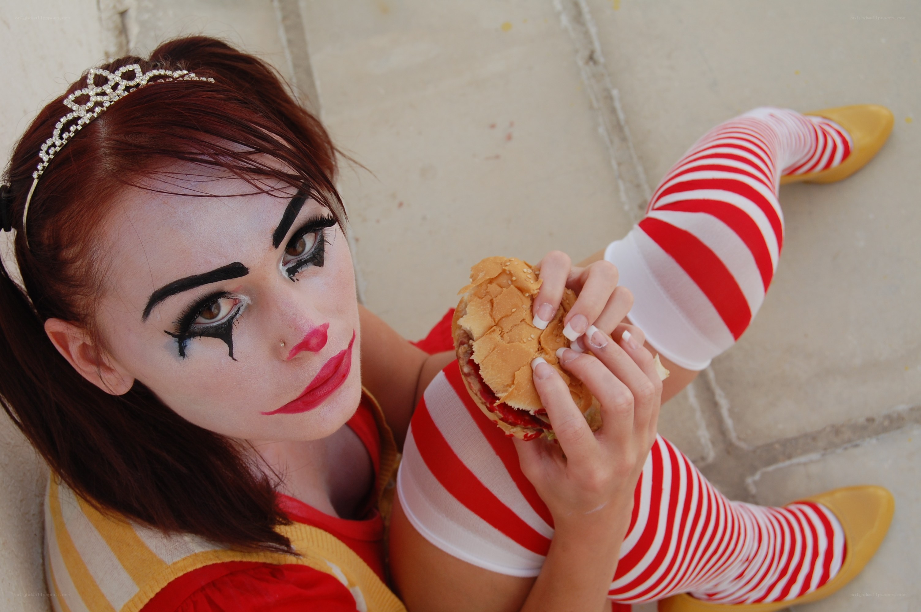 clown holding a burger
