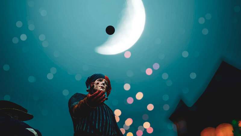Clown Juggling at Night