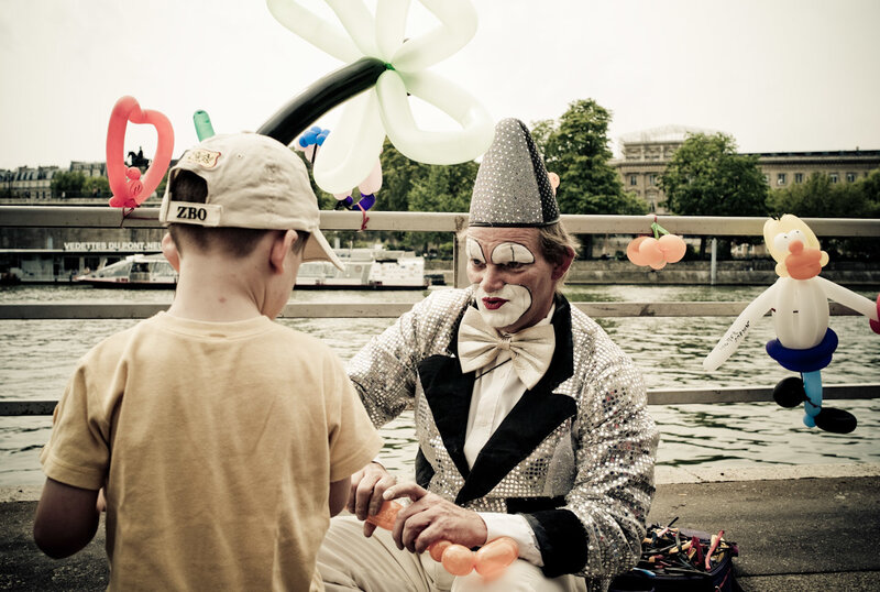 Clown making balloon animals