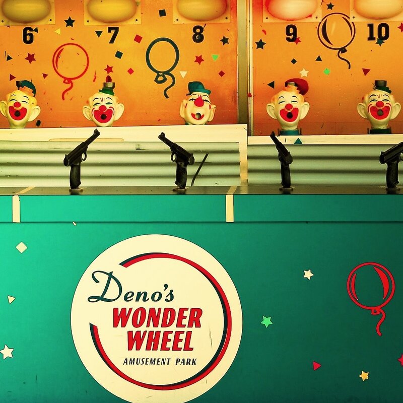 Clown shooting game at amusement park
