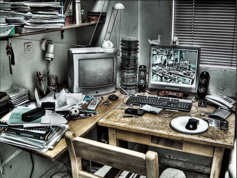 cluttered computer desk