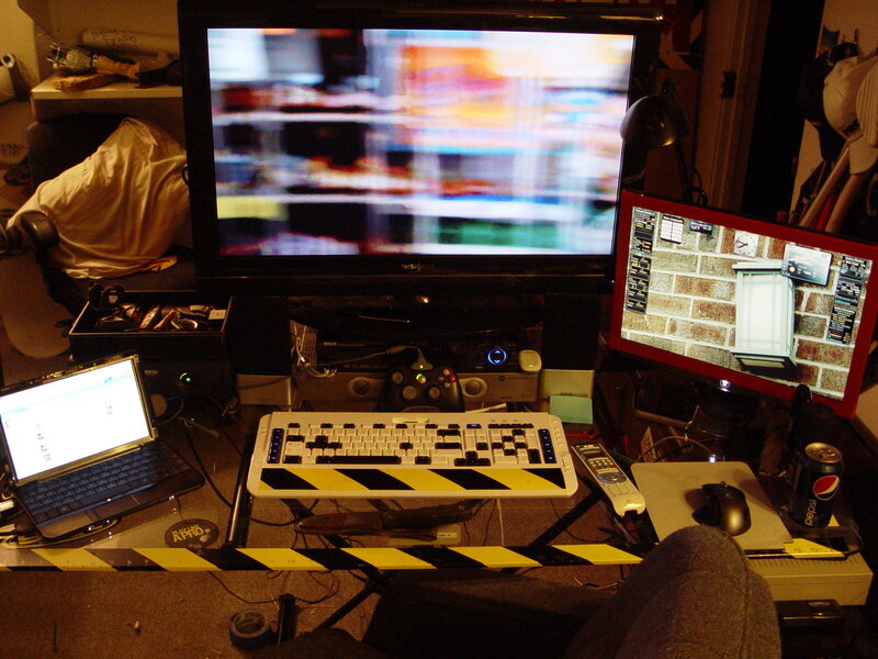 cluttered computer desk setup