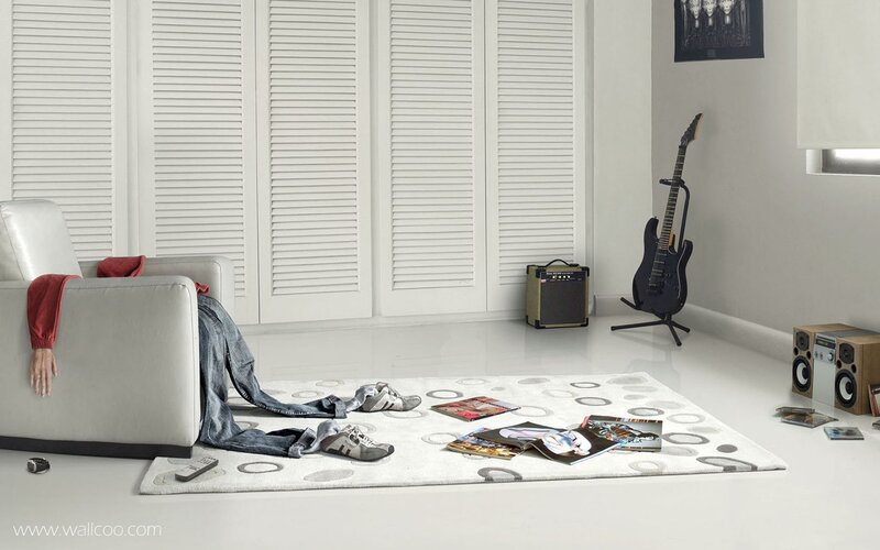 Cluttered living room with guitar