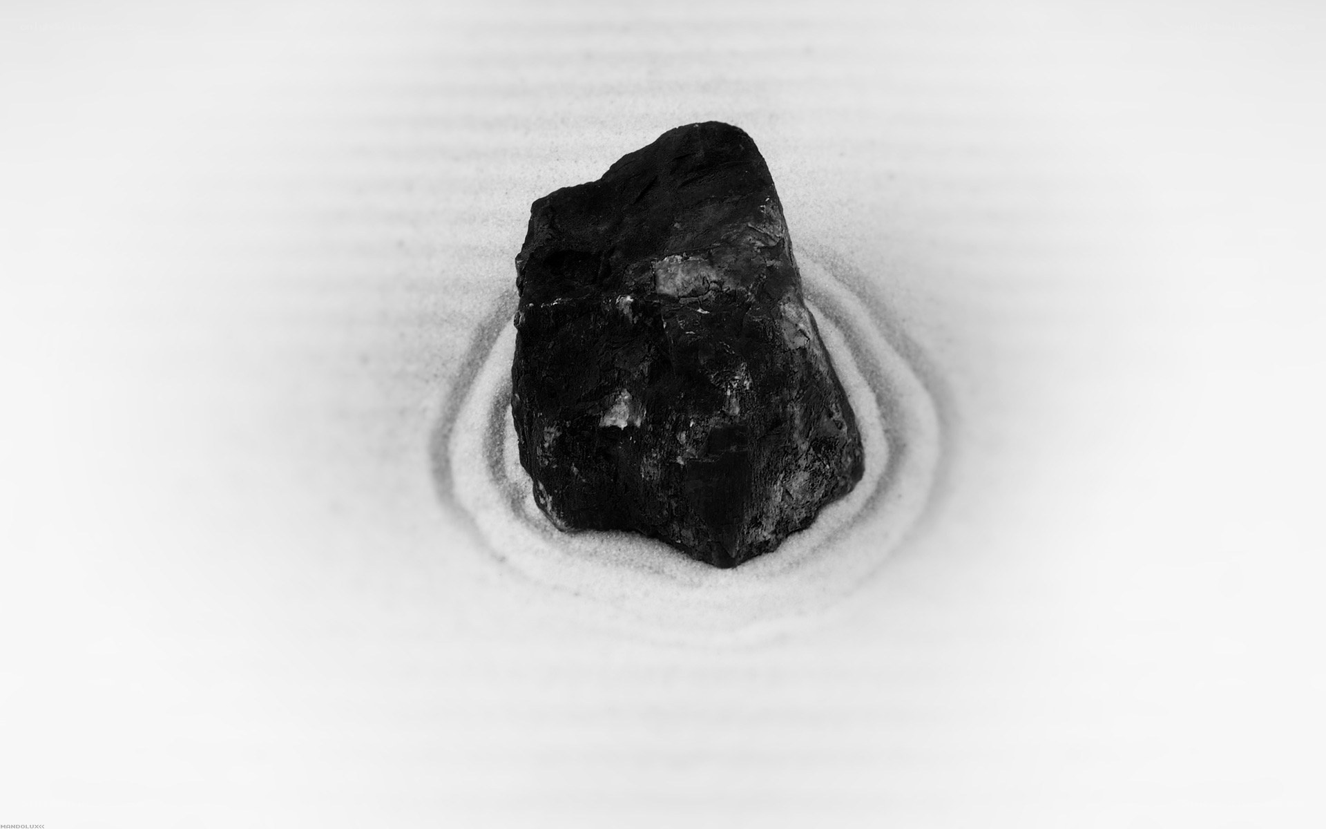 coal in sand circle