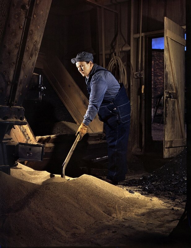coal worker shoveling coal