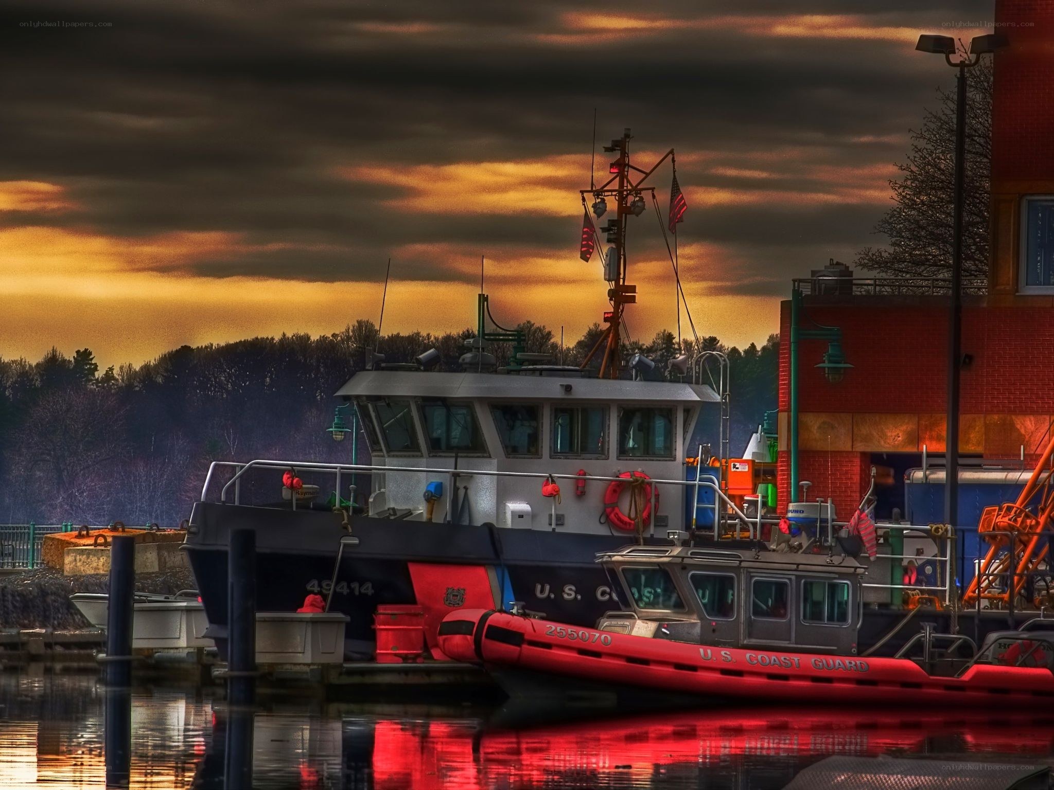 Coast Guard boats at sunset