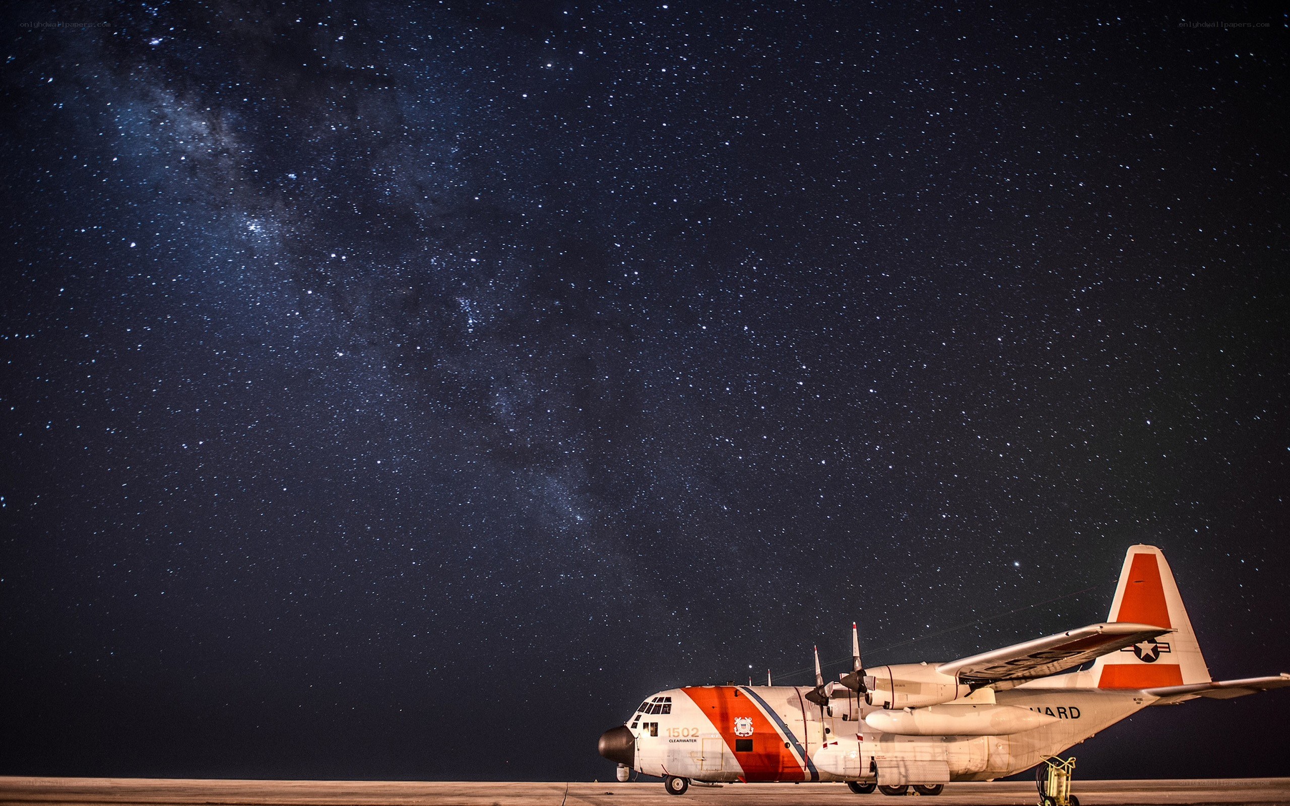 Coast Guard plane under stars