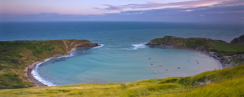 Coastal Bay at Dusk — Green, Serene, Sunset, Photograph, Boats