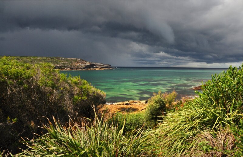 Coastal Bay under Storm Clouds