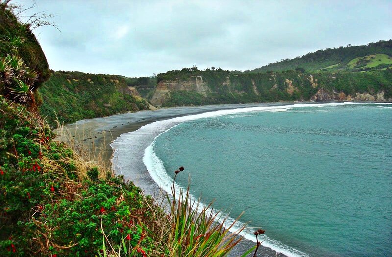 Coastal Bay with Black Sand