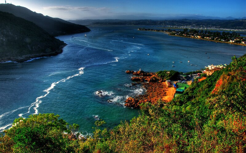 coastal bay with boats and hills