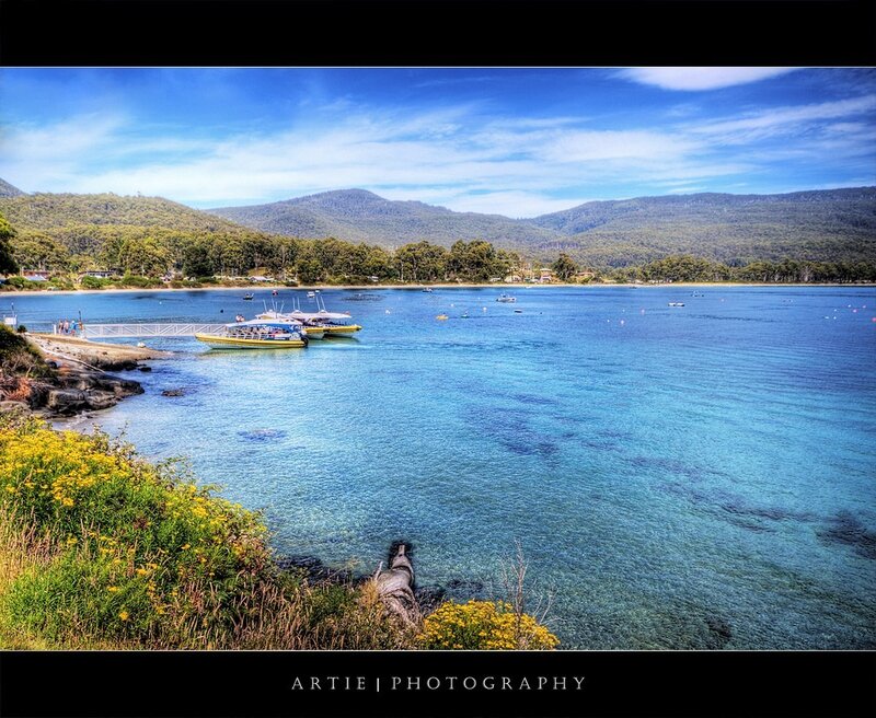Coastal Bay with Boats and Mountains