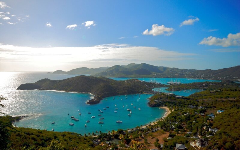 Coastal bay with boats and mountains