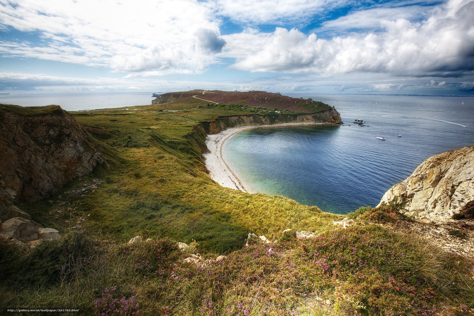 coastal bay with cliffs and boats