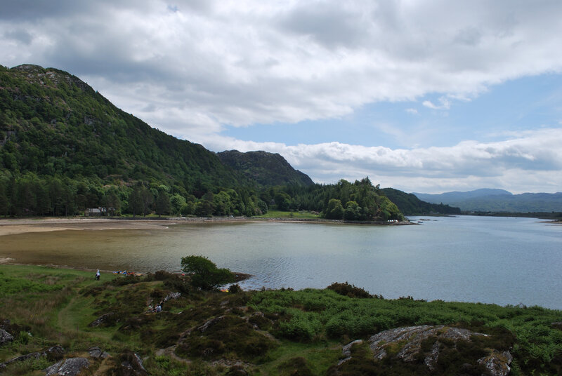 coastal bay with green hills