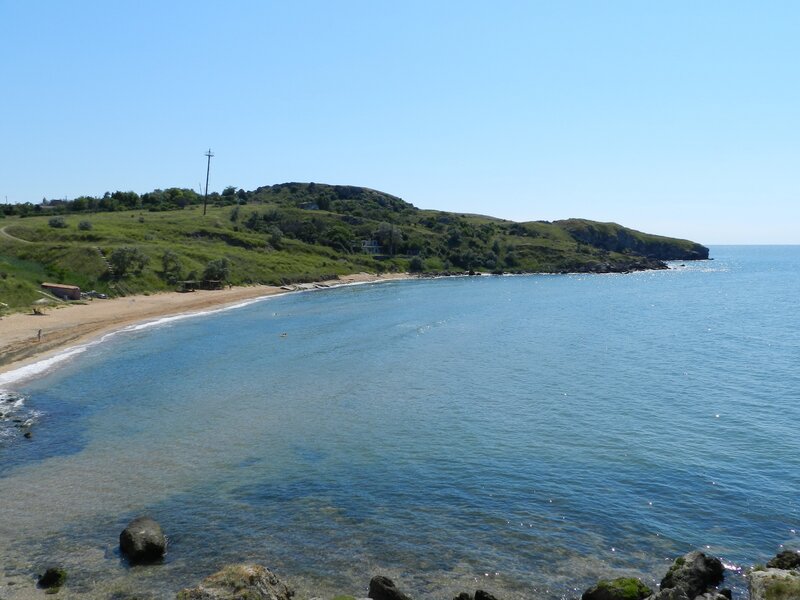 coastal bay with green hills
