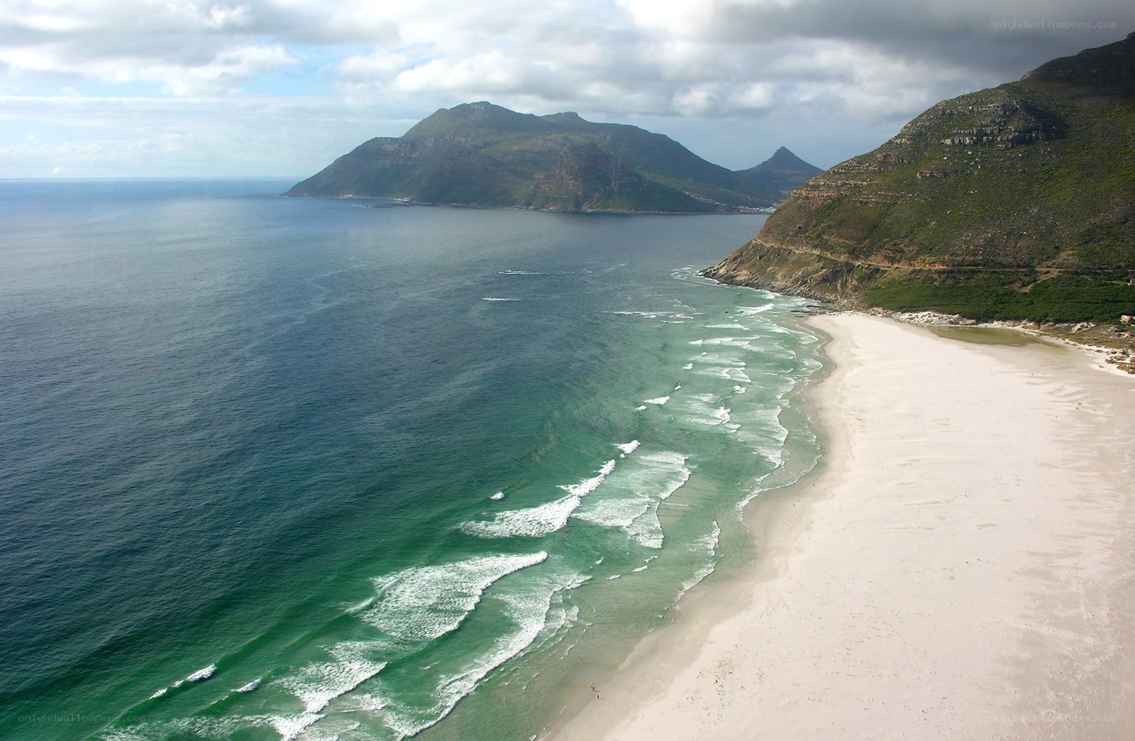 coastal beach with mountains