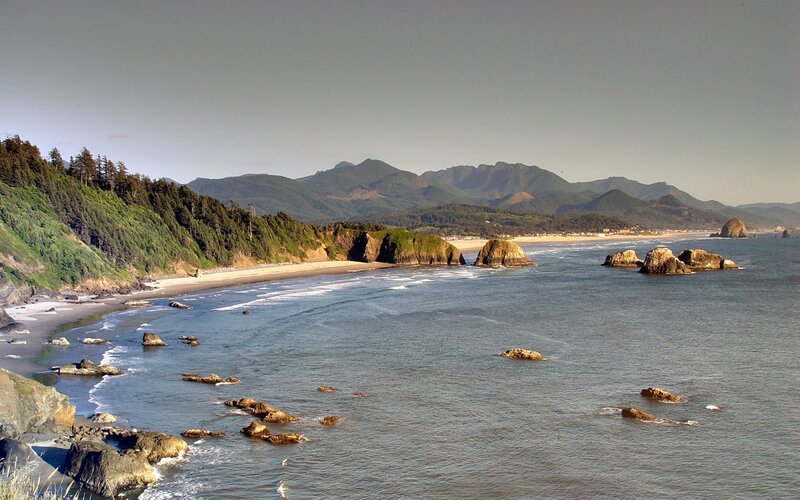 coastal beach with rocky outcrops