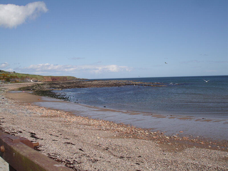 coastal beach with rocky shore