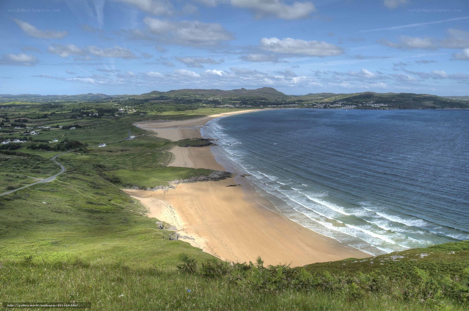 coastal beach with rolling hills