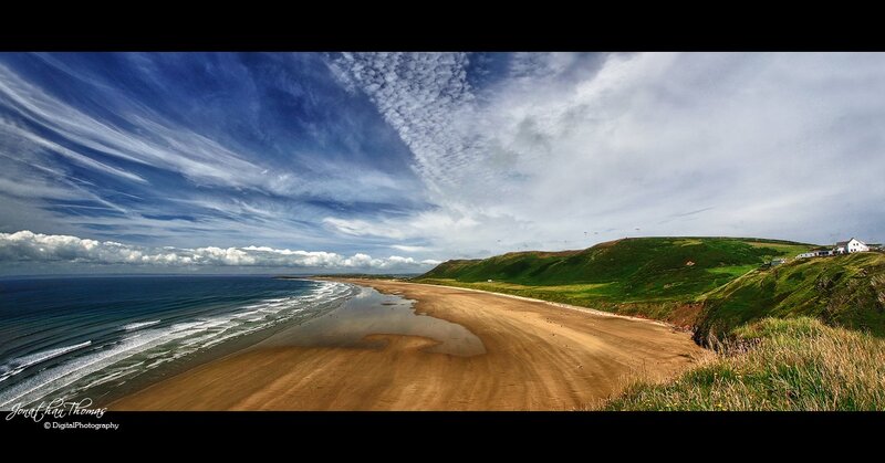 coastal beach with rolling hills