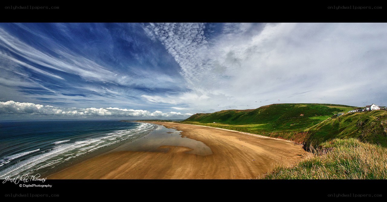 coastal beach with rolling hills