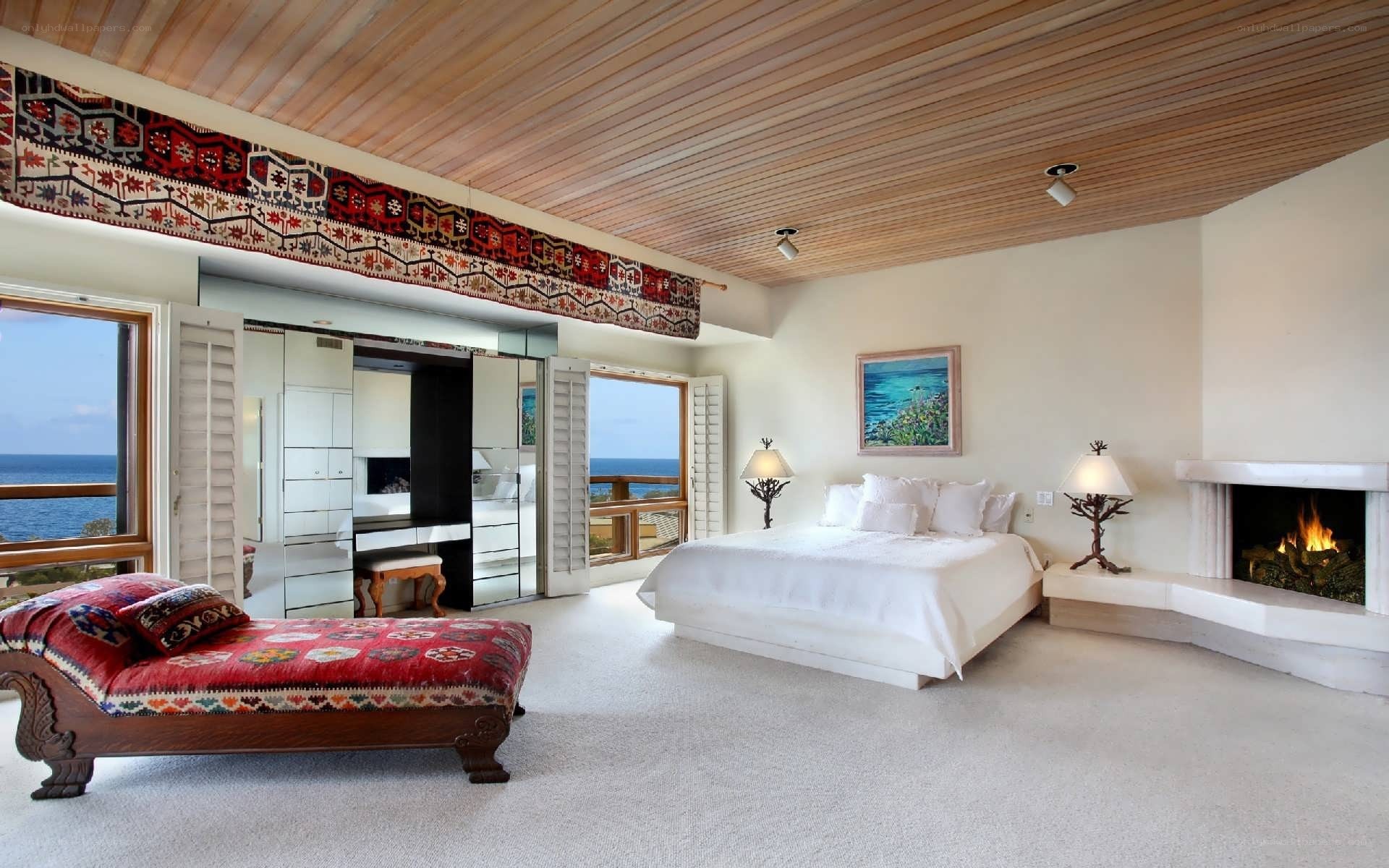 Coastal bedroom with fireplace