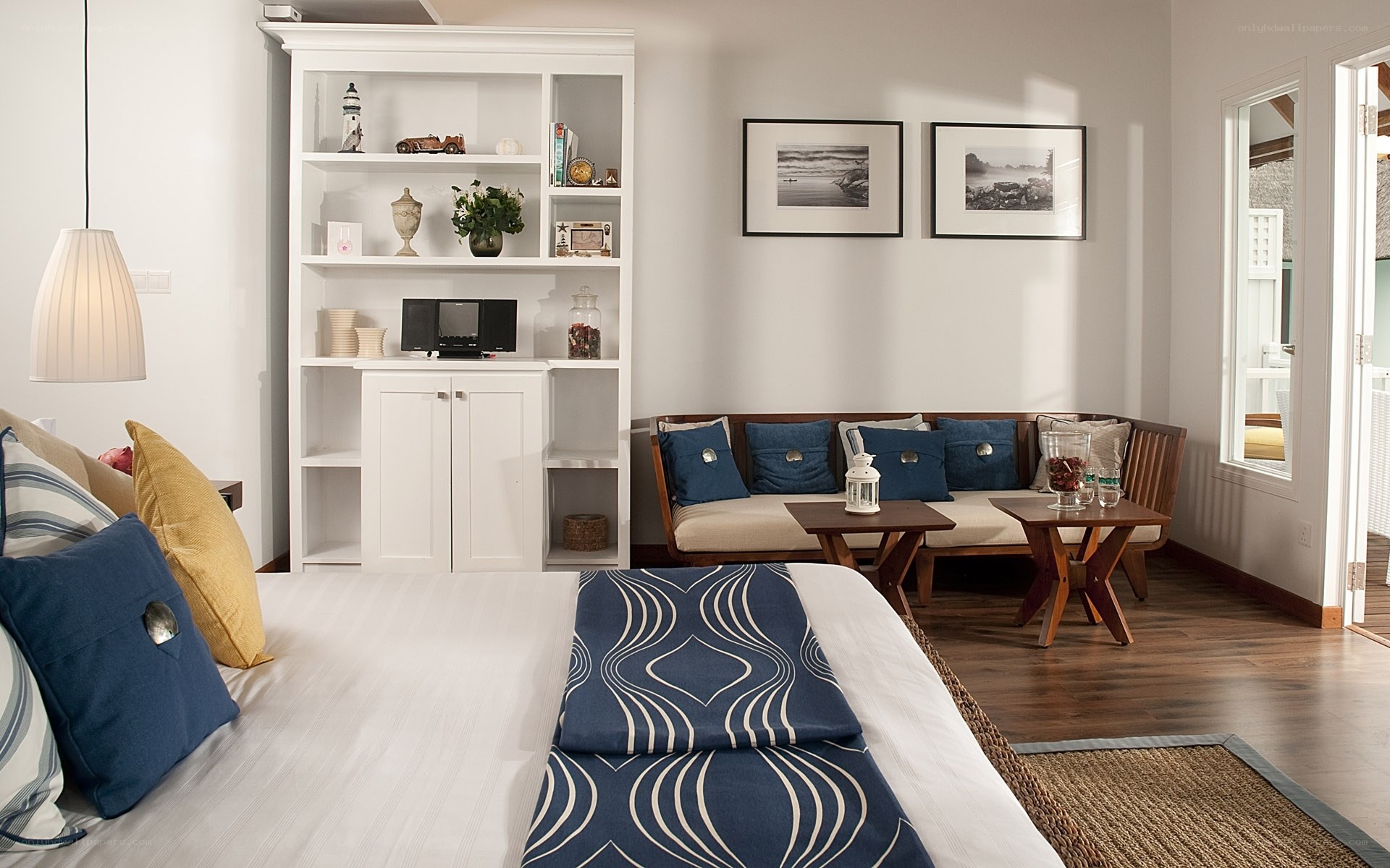 Coastal bedroom with seating area