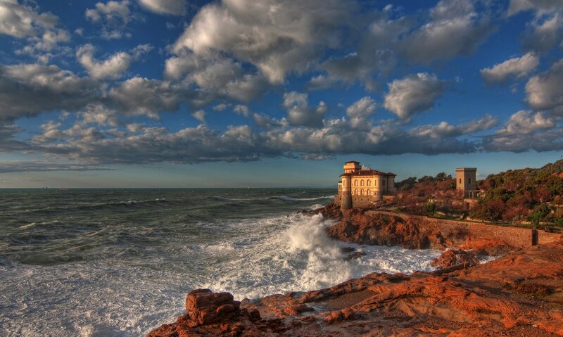 Coastal castle under dramatic sky