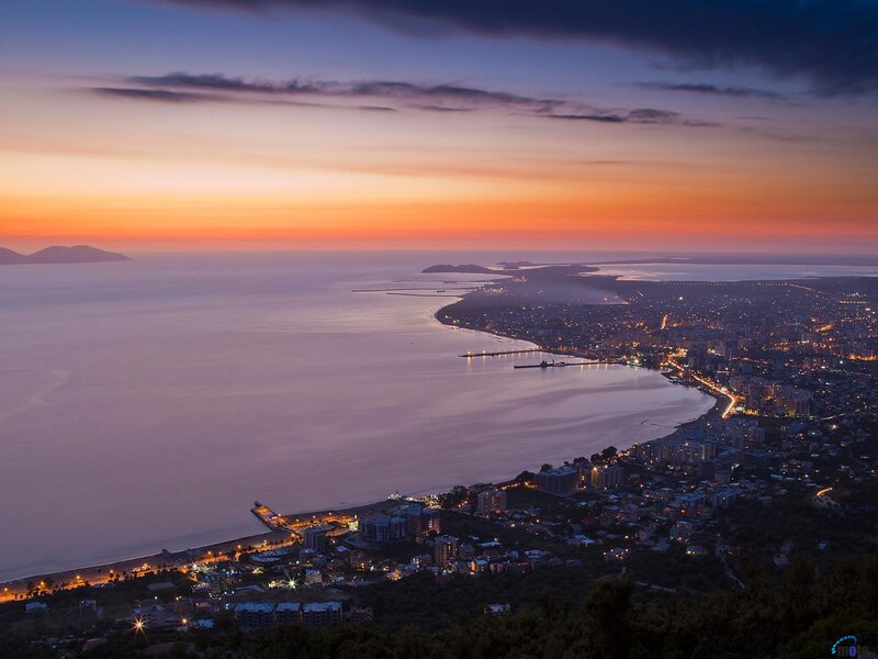 Coastal City at Dusk — Orange, Serene, Sunset