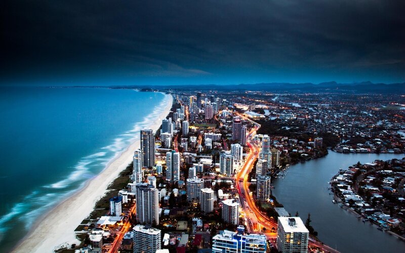 Coastal City at Night — Blue, Dramatic, Photograph