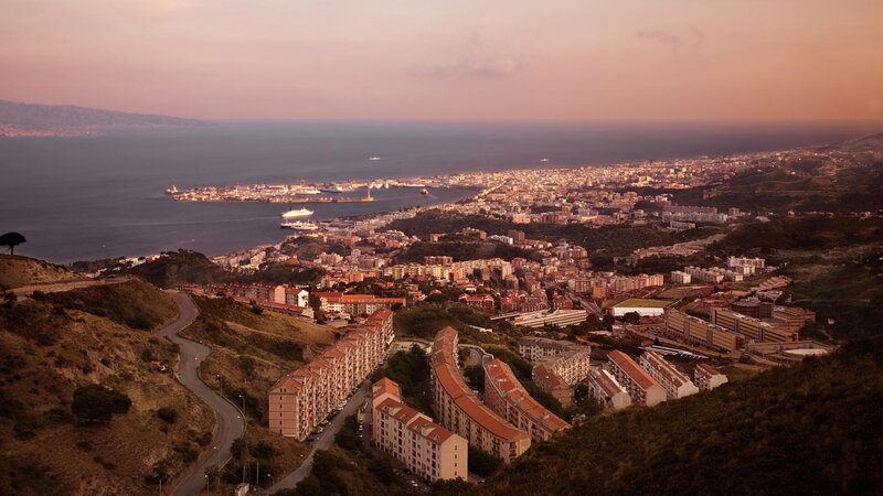 coastal city at sunset
