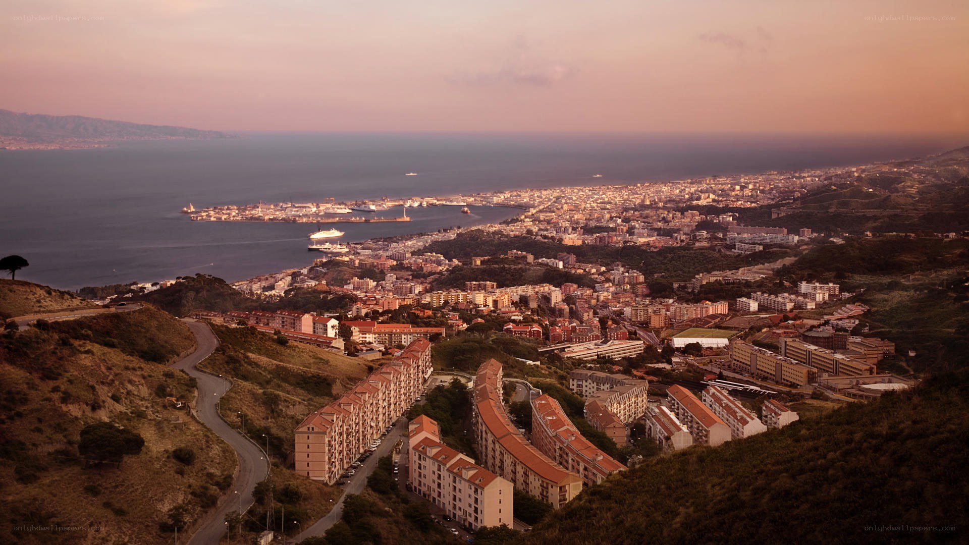 coastal city at sunset
