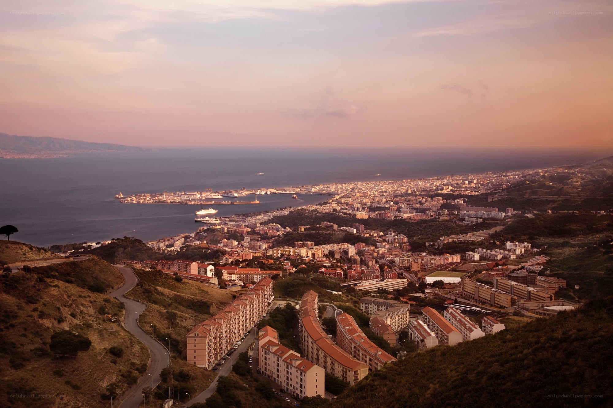 coastal city at sunset