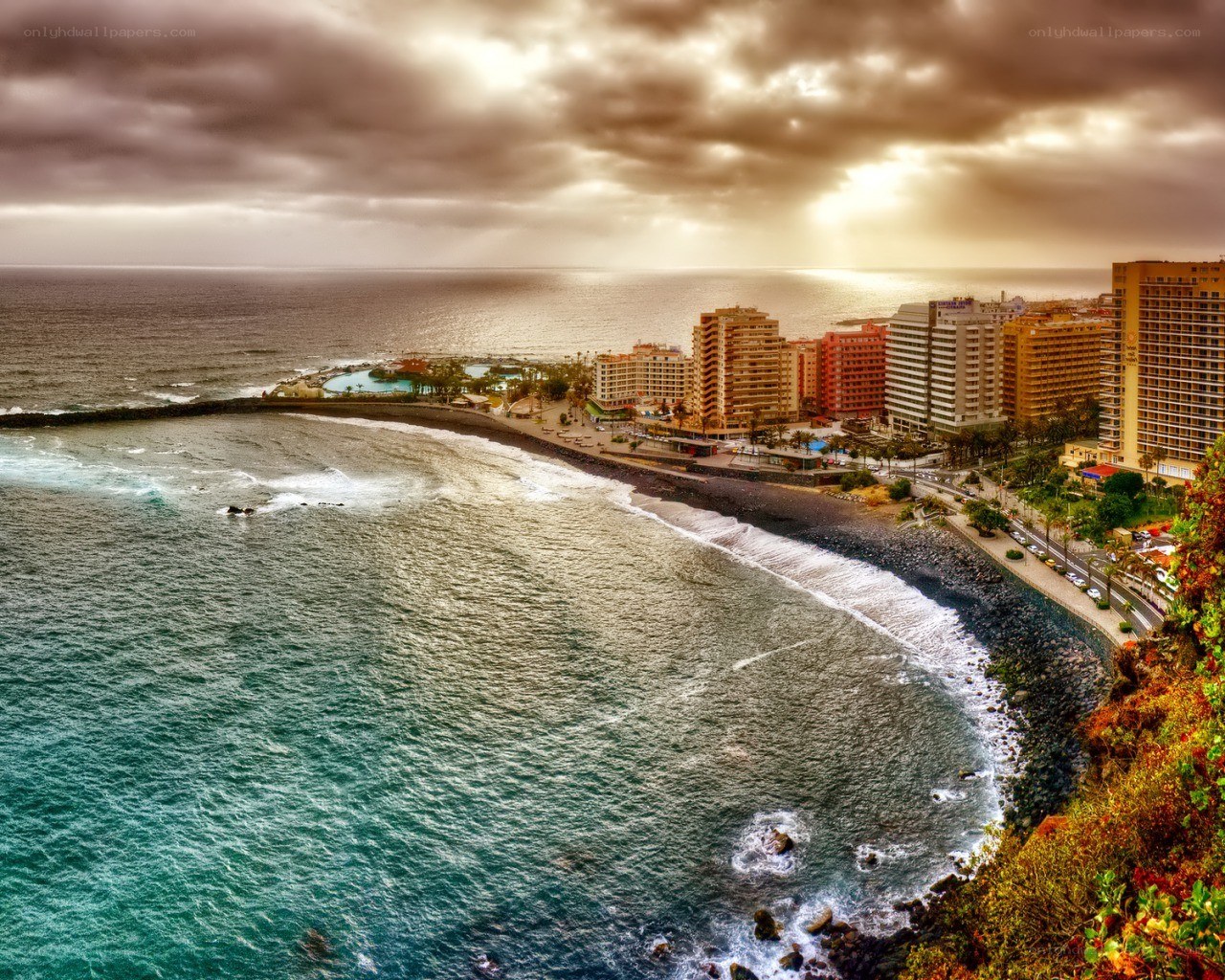 coastal city at sunset