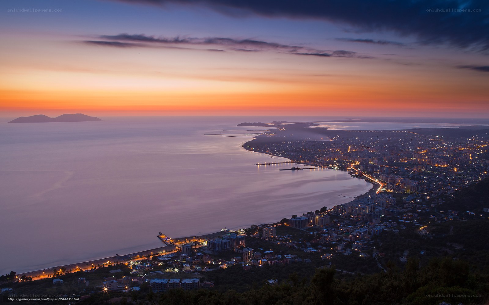 coastal city at sunset