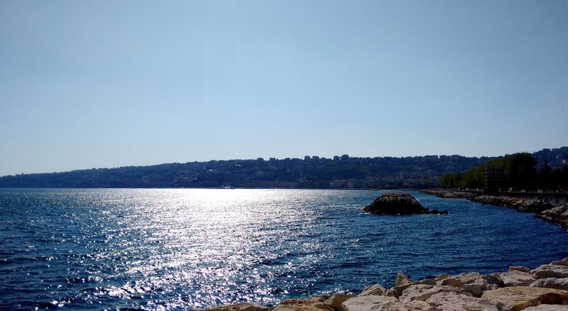 Coastal City View — Blue, Serene, Afternoon, Photograph, Sea