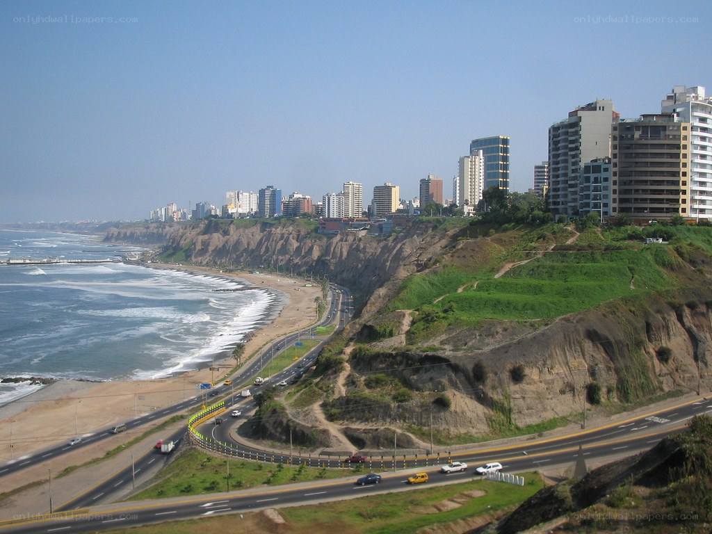 coastal city with cliffs and highway