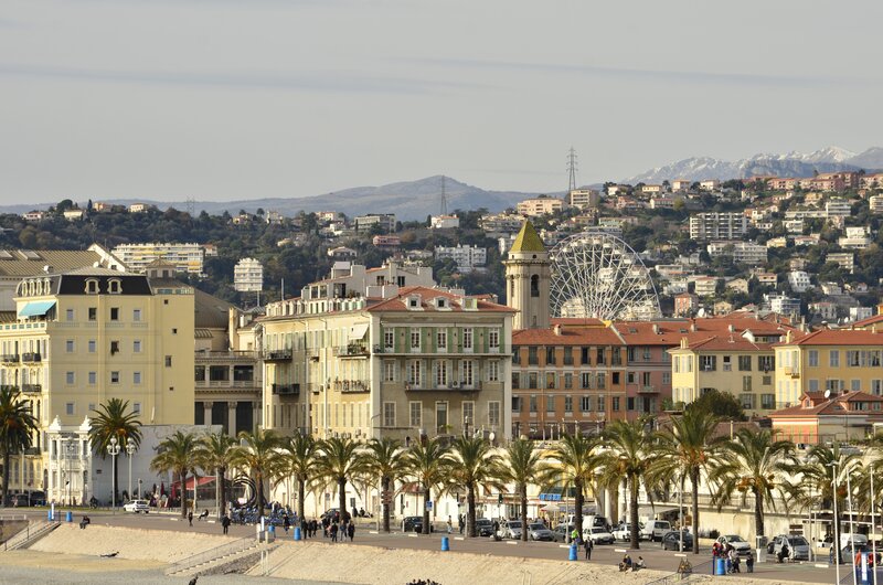 Coastal city with mountains in background