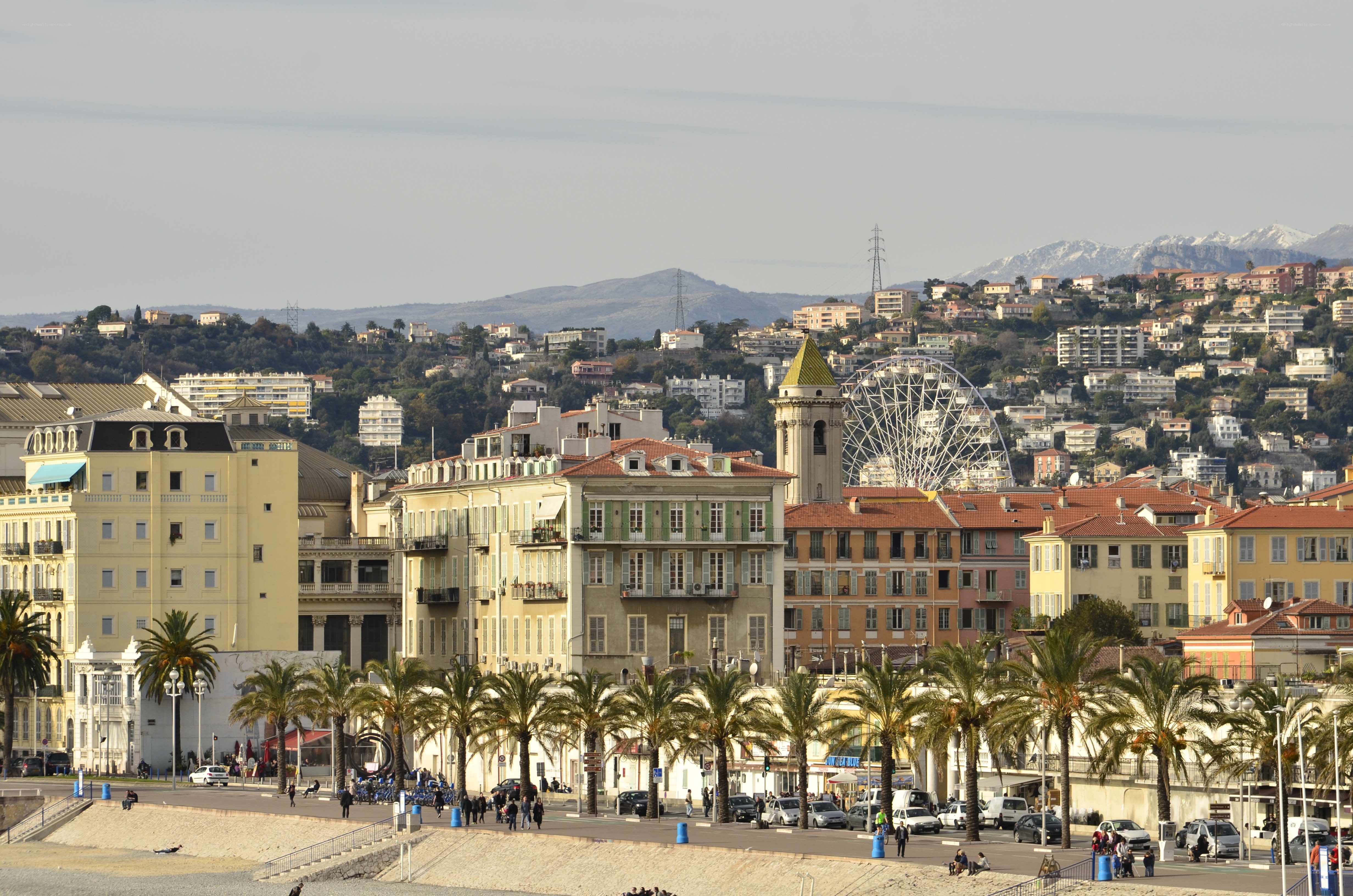 Coastal city with mountains in background
