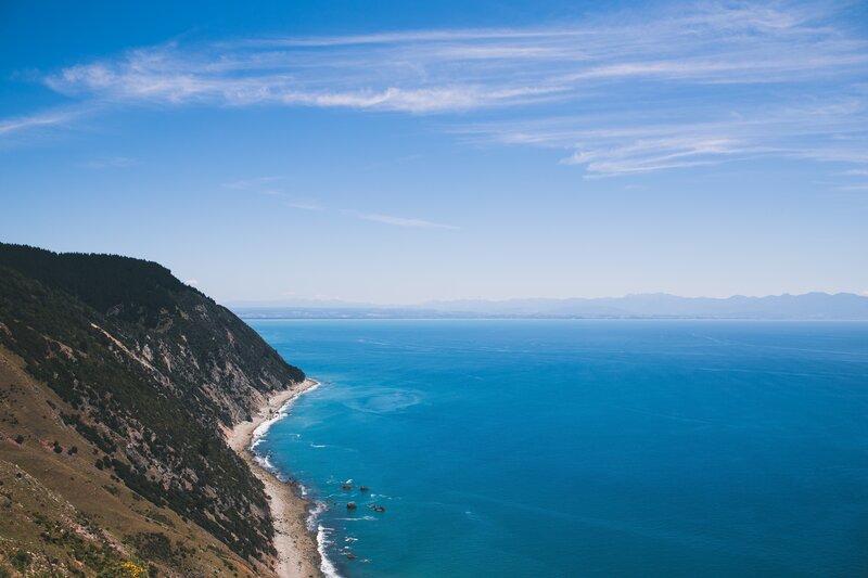 Coastal Cliff and Ocean — Blue, Serene, Afternoon