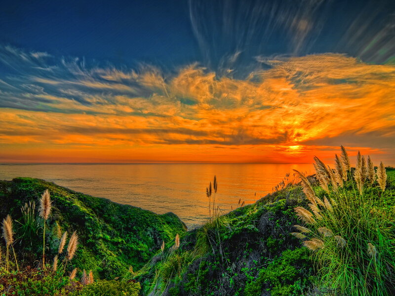 Coastal Cliff at Sunset — Orange