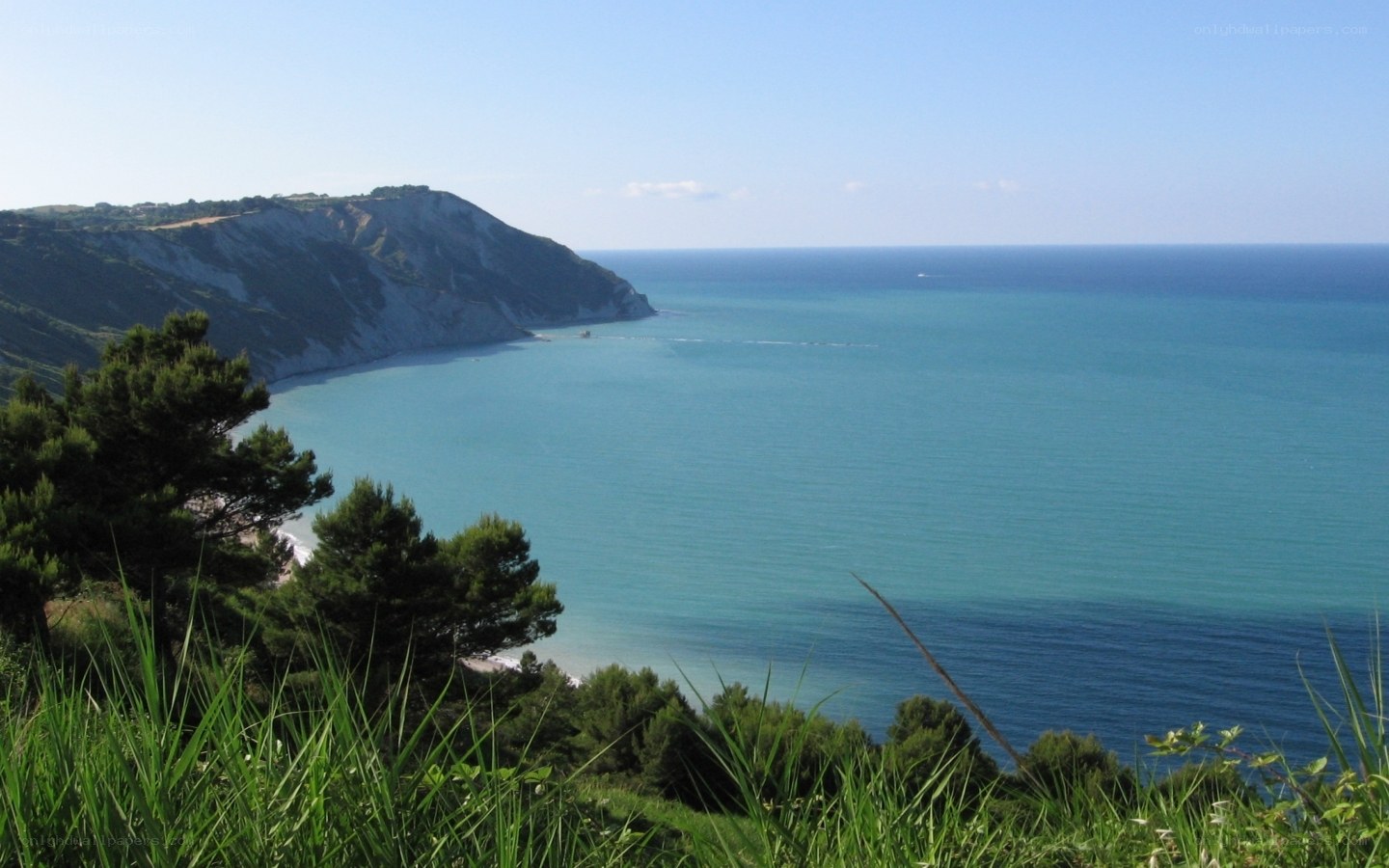 coastal cliff overlooking turquoise sea