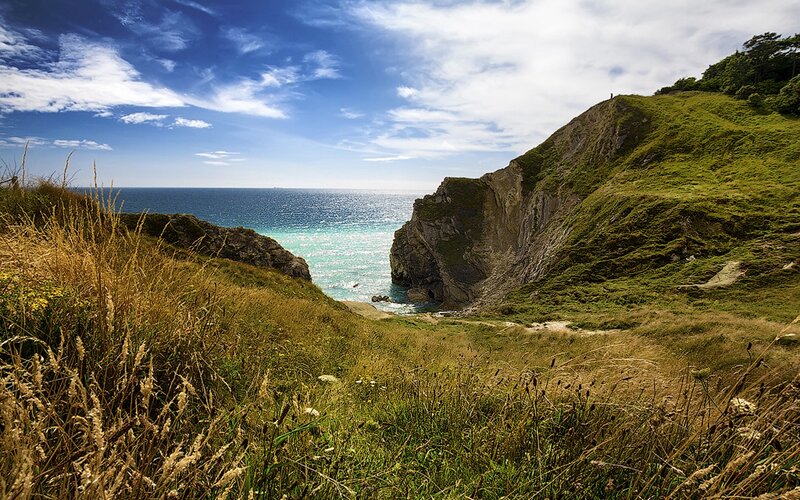 Coastal Cliff View — Blue, Serene, Afternoon, Photograph, Ocean
