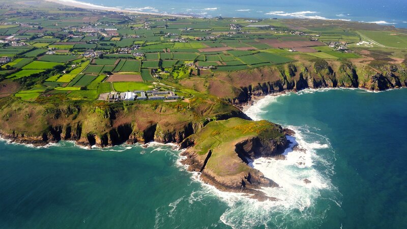 coastal cliffs and farmland aerial view