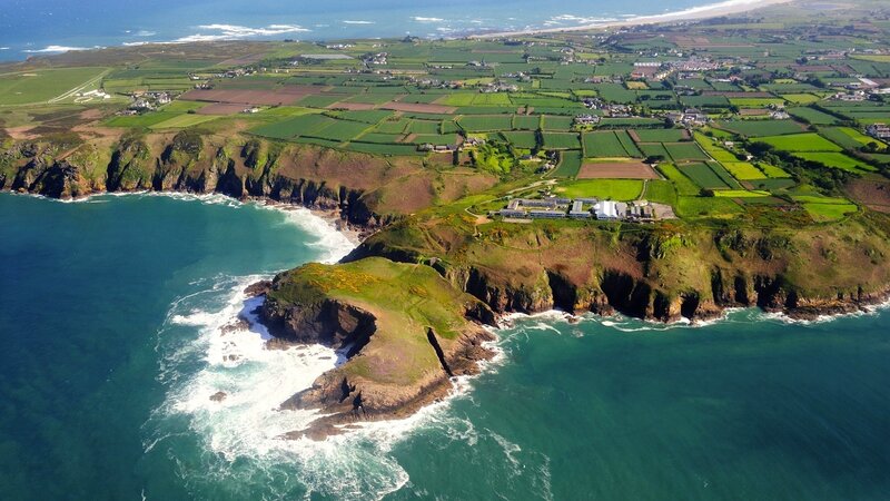 coastal cliffs and farmland aerial view