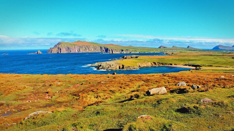 coastal cliffs and green fields