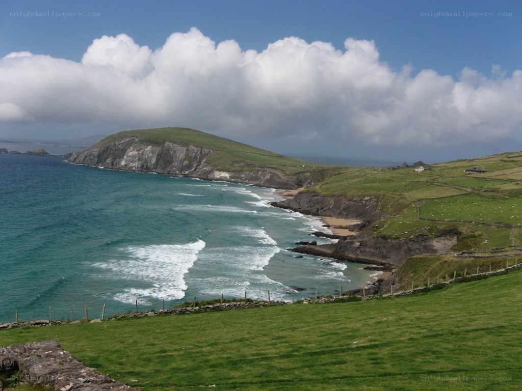 coastal cliffs and green hills